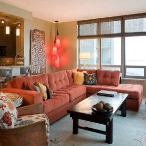 condo-living-room-design-with-decorative-corner-pendant-lights-and-wall-decor-and-coral-sectional-sofa-and-brown-side-chair-and-coffee-table-300x300.jpg